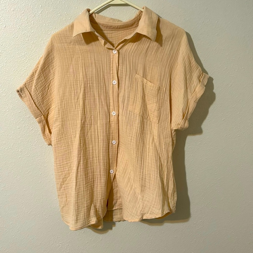 Cotton, medium , short sleeve button up shirt.